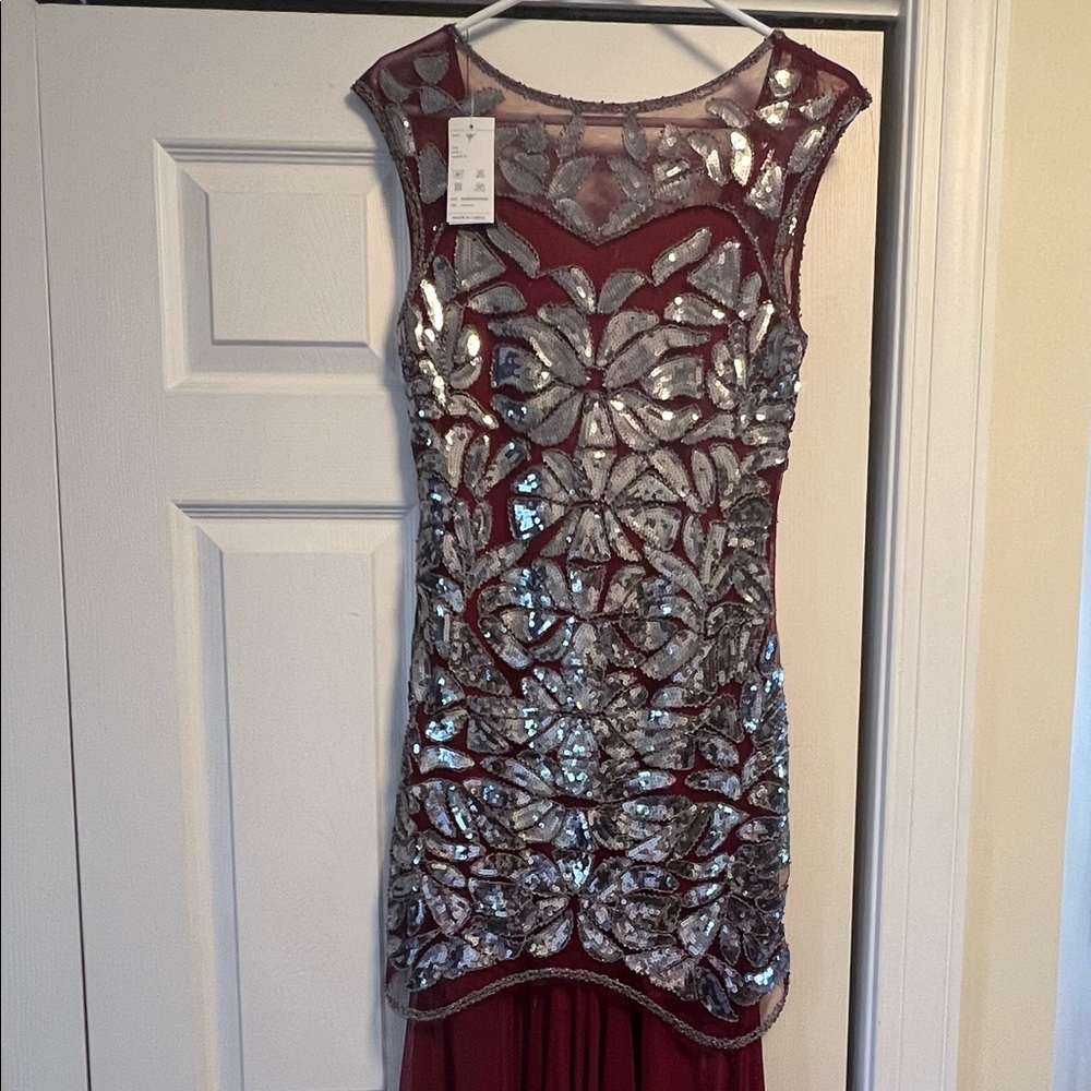 Beautiful embellished burgundy gown.